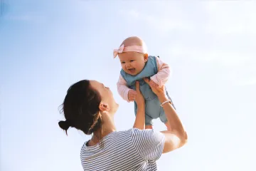 Photo of a mother holding her infant