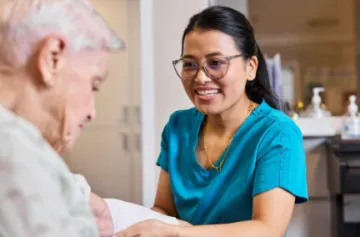Nurse helping an elderly aged care patient