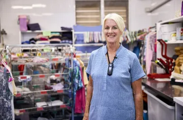 Image of an elderly woman at a charity shop