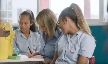 image of girls and nurse providing vaccination
