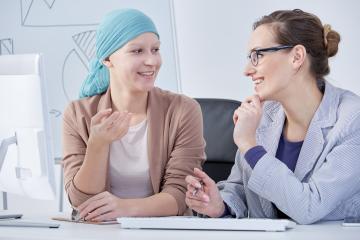 Female cancer patient with health care provider