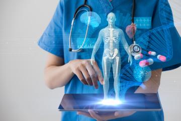 Hologram of a human skeleton on top of a computer tablet