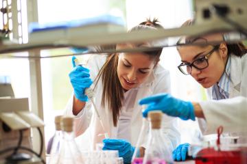 Photo of 2 lab technicians