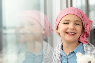 Young child wearing a head scarf