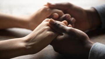 Couple holding hands