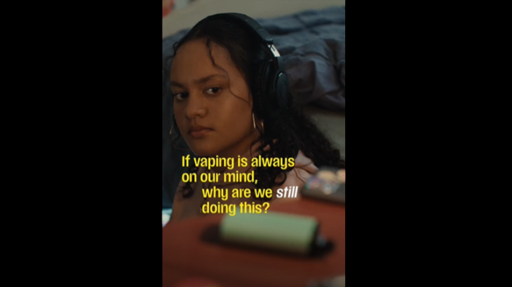 Girl looking at a vape