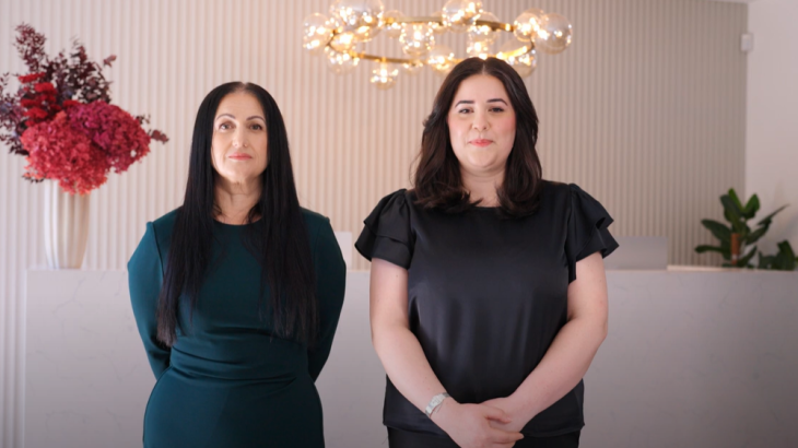 Screen capture from video with two women standing