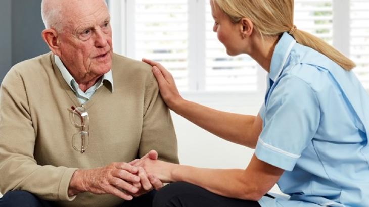 older person talking with medical professional