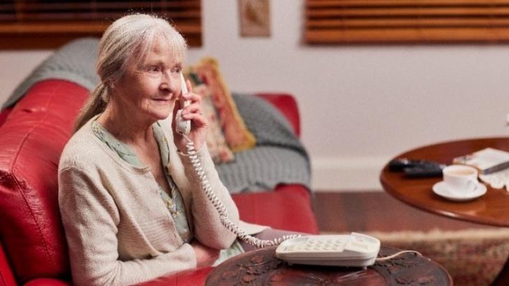 Elderly woman on the phone at home