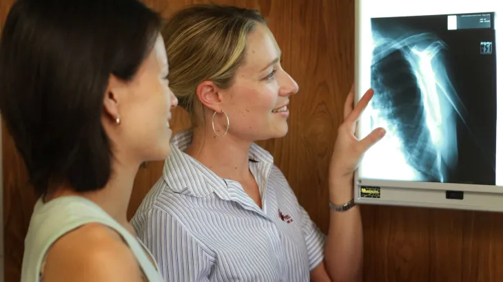 Two medical officers looking at an xray