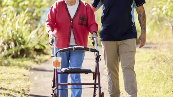 Image of elder woman with carer