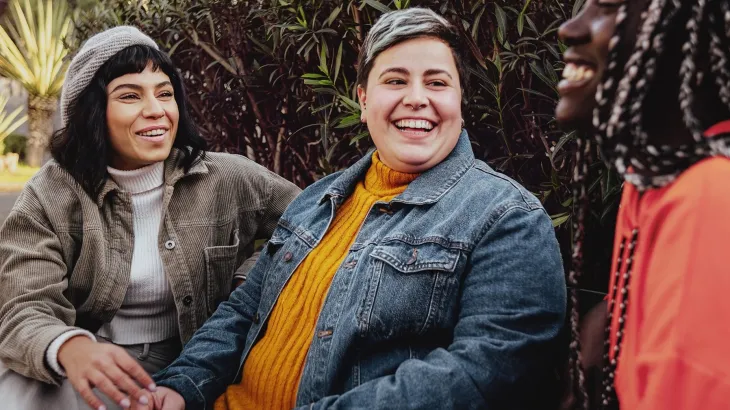 Three young women of different ethnicity having a discussion