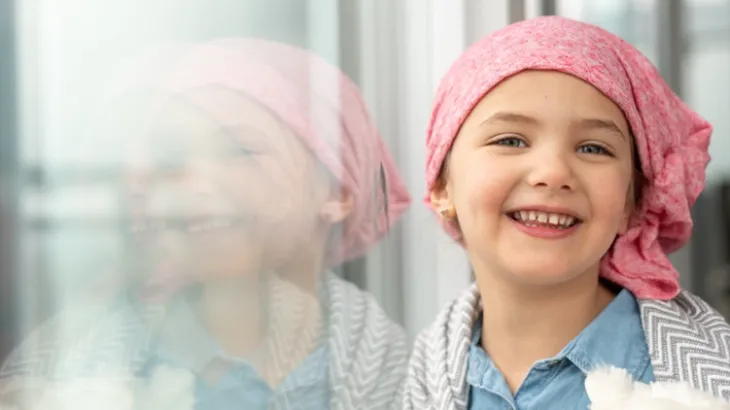 Young child wearing a head scarf