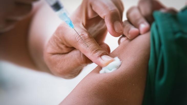 Close up image of a vaccine being administered 
