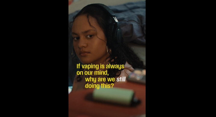 Girl looking at a vape