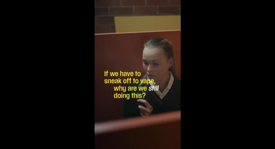 Girl vaping in a toilet stall