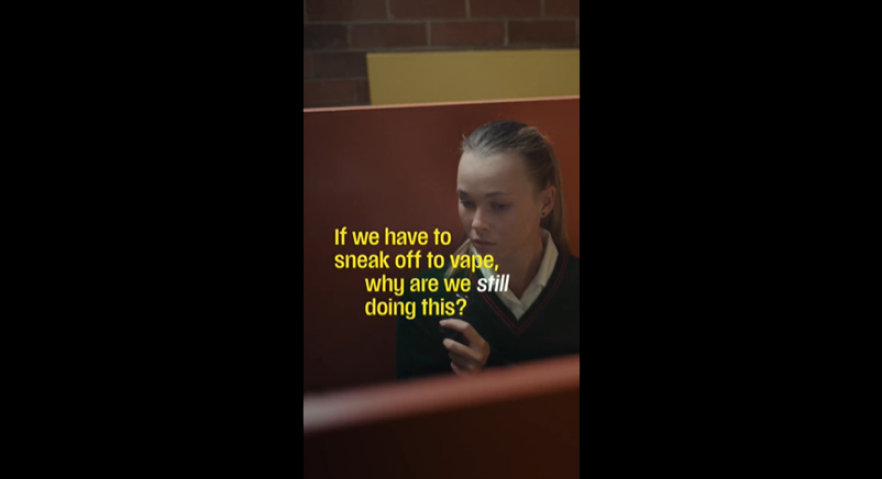 Girl vaping in a toilet stall