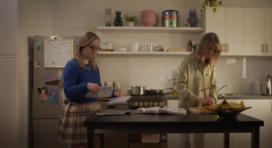 Video still of 2 women in a kitchen