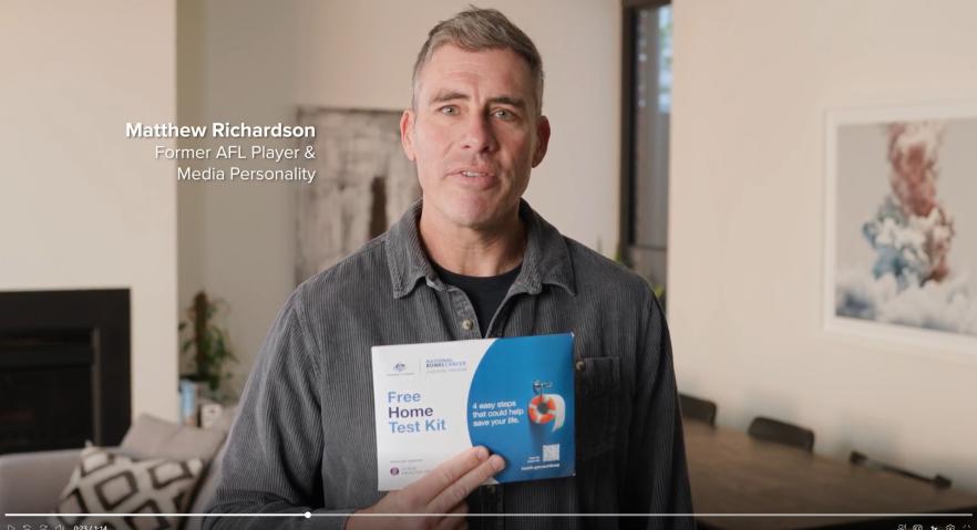 Matthew Richardson [Former AFL Player and Media Personality] holding Bowel cancer kit