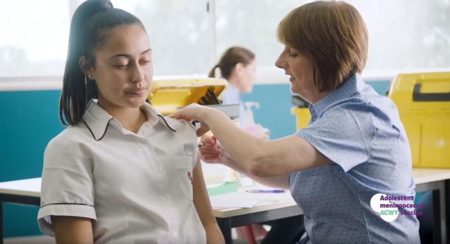 Image of girl and nurse providing vaccination