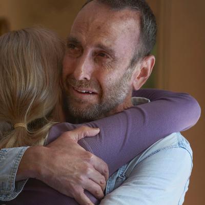 Man hugging a woman