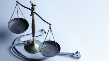 Scales of justice and a stethoscope