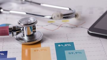 Stethoscope and financial chart