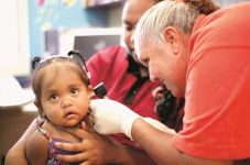 Image of child getting ears checked